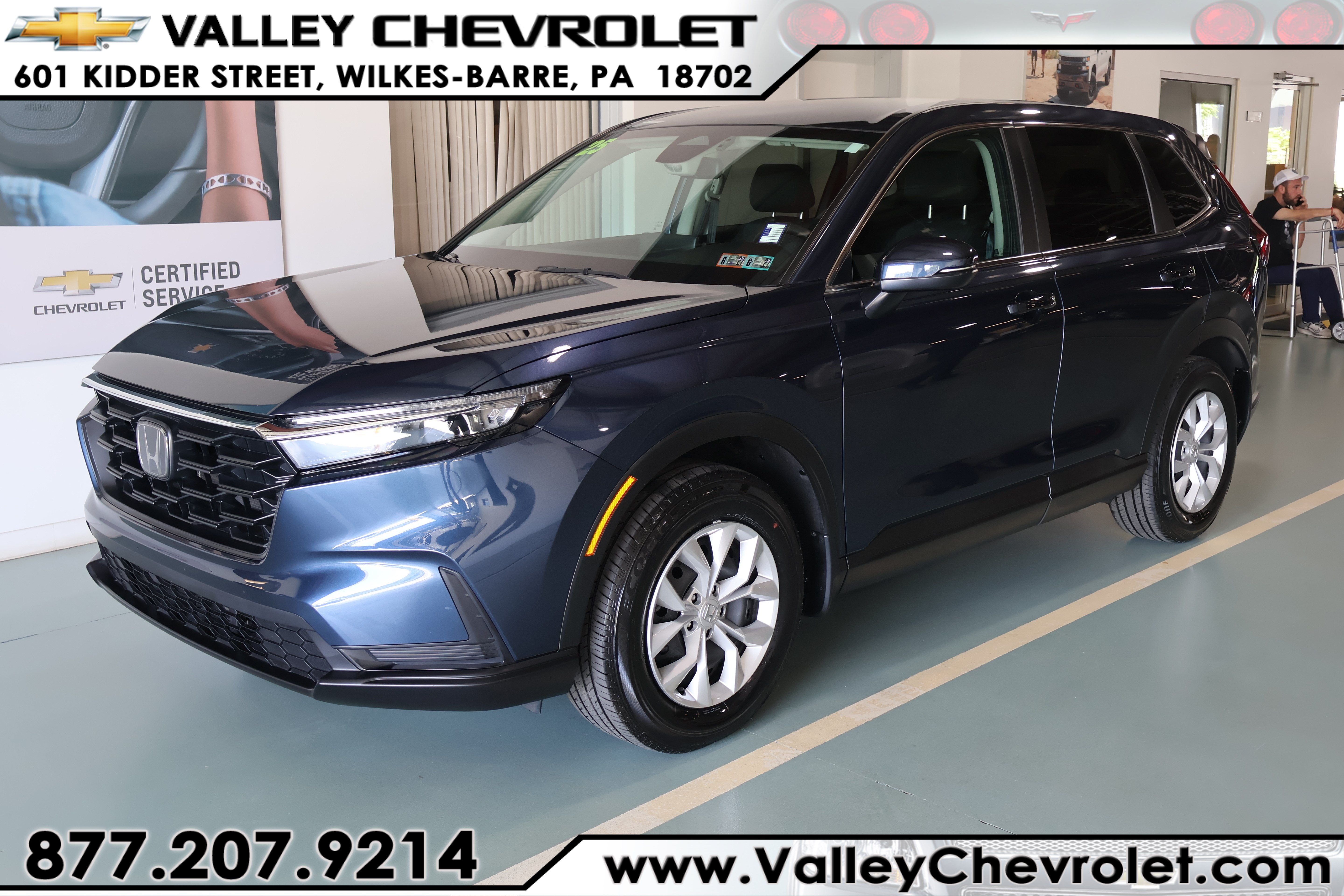 2025 Honda CR-V LX AWD in Blue — front three-quarter view