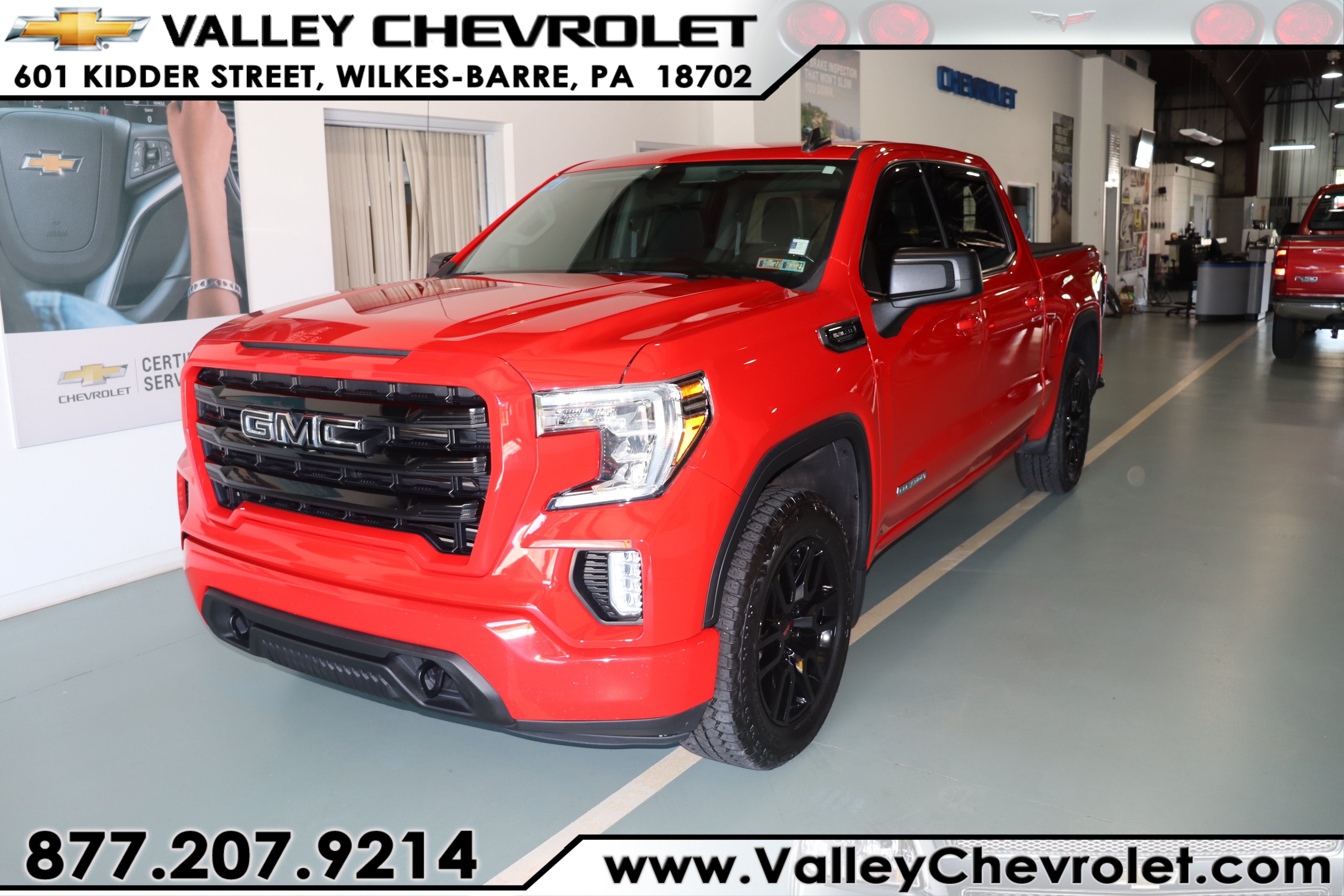 2021 GMC Sierra 1500 Elevation in Cardinal Red — front three-quarter view